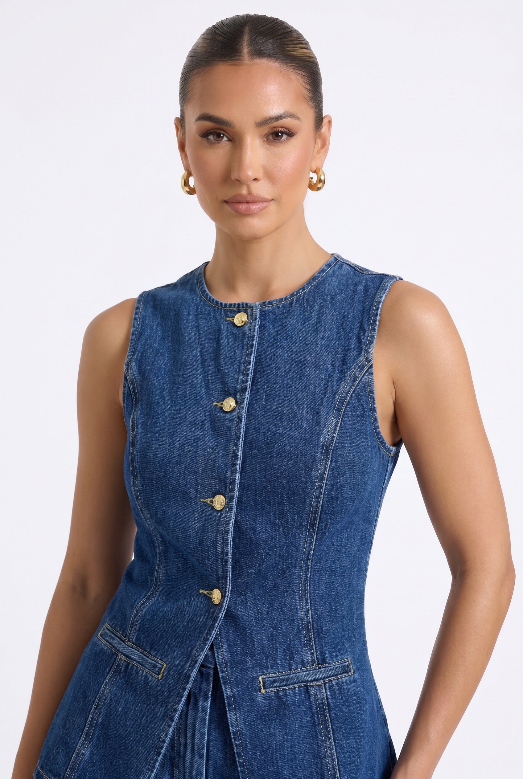 Close-up detail of Luna Indigo co-ord gold button-up front, functional pockets, and structured stitching